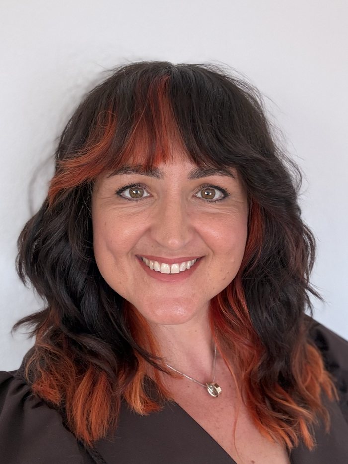 Portrait of Dr. Celia Blanco against a starfield